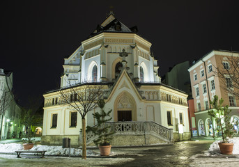Fototapeta na wymiar Bavaria, Germany, church Sankt Nikolaus in the Rosenheim at winter night 