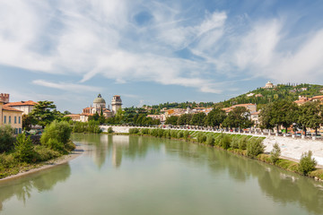 Fototapeta na wymiar Sunny view of Adige river in Verona, Veneto region, Italy.