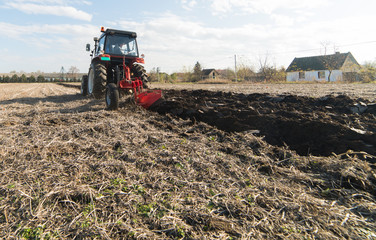 Tractor preparing land for sowing