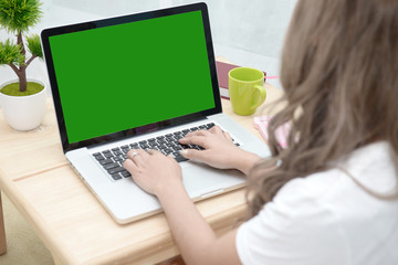 Woman with running in the laptop. Green screen background
