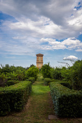 Ancient brick tower and garden of the Renaissance