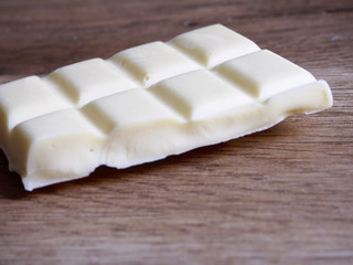 White chocolate on wood background