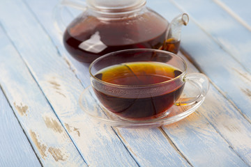 tea kettle cup vintage wood background
