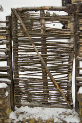 Wicker gate in the fence.