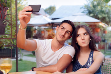 Romantic Couple on a Date at the Restaurant Taking a Selfie 