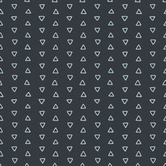 Seamless hand drawn geometric tribal pattern with triangles. Vector navajo design.