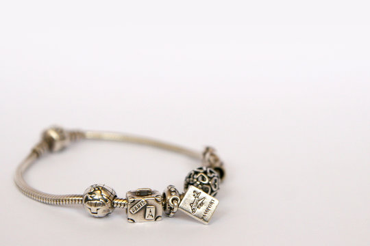 Silver beads and charms isolated