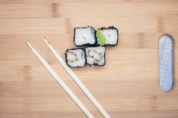 Rolls with vegetables and chopsticks
