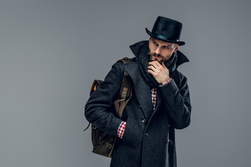 A man in a grey cylinder hat.