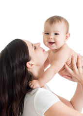 Portrait of mother and baby laughing and playing