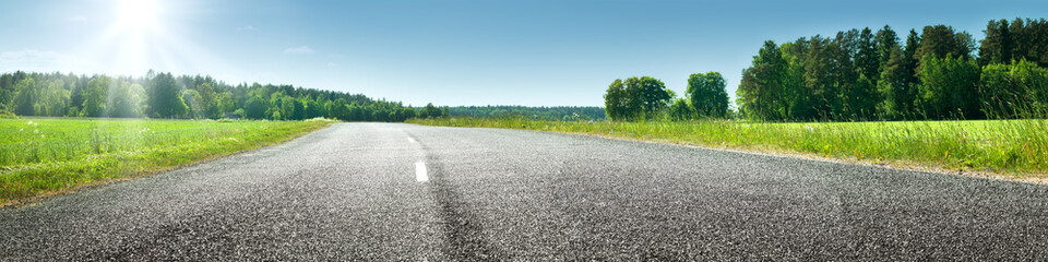 asphalt road panorama in countryside on sunny spring day - obrazy, fototapety, plakaty