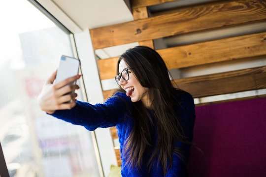 Young girl take selfie on her phone