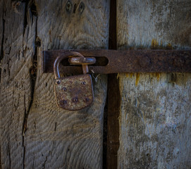 The lock on an old wooden door