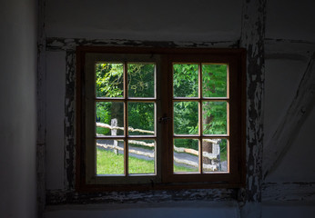Fototapeta na wymiar The wall and window of an old farmhouse inside