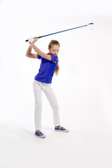 Pretty girl golfer swinging with diver on white backgroud in studio