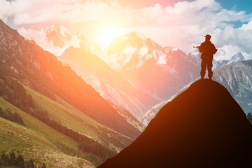 silhouette of a soldier with a gun in the sunset