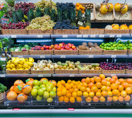 Fresh fruits and vegetables on shelf in supermarket