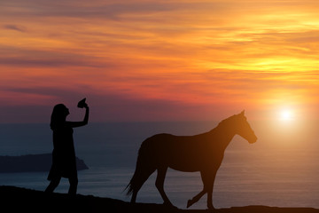 silhouette of a girl at sunset let a paper plane