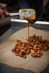 Preparing almond caramel on restaraunt kitchen