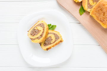 Egg rolls with meat on a white background