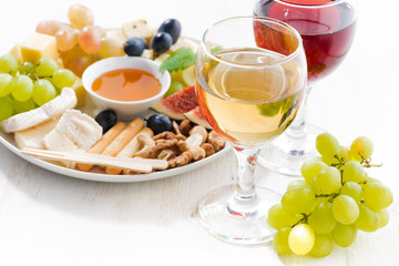 glasses with wine and snacks, closeup