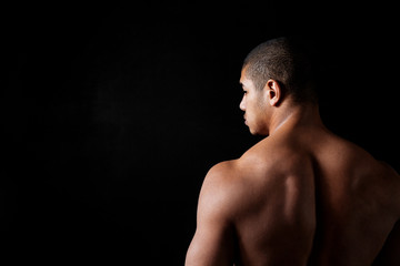 Fototapeta premium Back view of attracive naked young fitness man