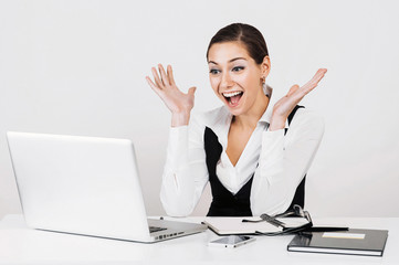 Portrait of a young happy surprised business woman