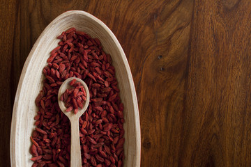Goji berries on the wooden table