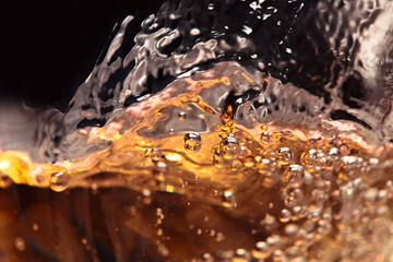 Abstract splashes of white wine on a black background