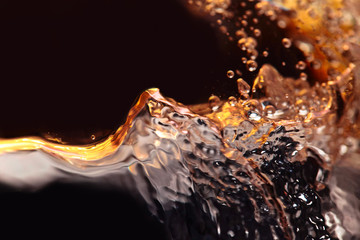 Abstract splashes of white wine on a black background