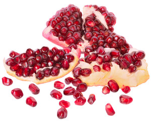 slice the pomegranate with scattered grain isolated