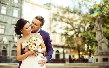 Portrait of young bride and groom at happy wedding day