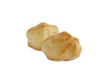 Sweet tasty eclairs or profiterole on white background. French dessert. Izolated