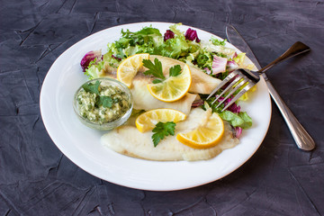 steamed tilapia fish with salad and tartar sauce with appliances