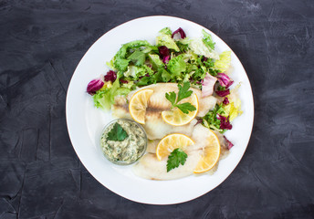 steamed tilapia fish with salad and tartar sauce with appliances