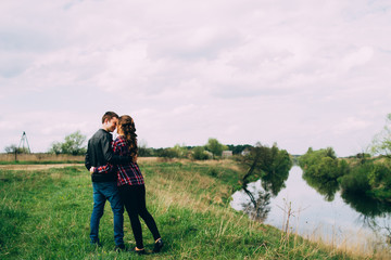 Portrait of Happy Young couple near river