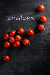 Tomatoes over dark background