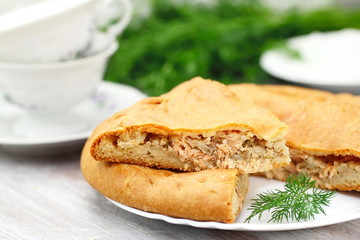 Pie with red fish and rice