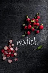 Radish over dark chalkboard background