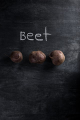 Beet over dark chalkboard background