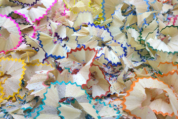 Varicoloured shaving from pencil on white background