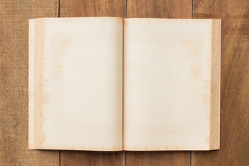 Old blank book open on the wood table