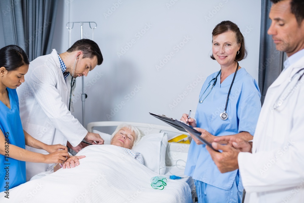 Canvas Prints Doctors examining patient in ward 