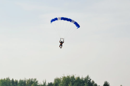 parachute on blue sky background