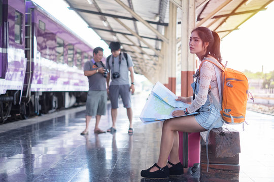 Beautiful young tourist in train station