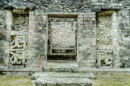 temple in ruins with reliefs in the Mayan archaeological Chicanna enclosure in the reservation of the biosphere of Calakmul, Campeche, Mexico