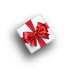 White Celebration Gift Box with Red Bow Isolated on White