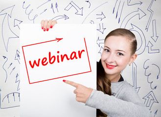 Young woman holding whiteboard with writing word: webinar. Technology, internet, business and marketing.