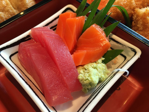Japanese traditional food sashimi with tuna and sashimi with salmon and wasabi sauce.