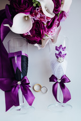 Wedding rings on a background of bridal bouquet